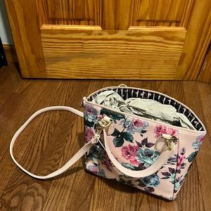 An Elegant bag, light pink  decorated with flowers